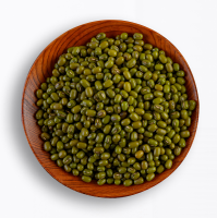 Green mung beans in a wood bowl, frontal picture
