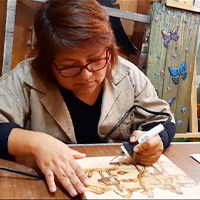 Craftswoman Working on Wood