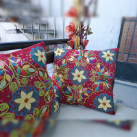 Butterflies in red field cushion