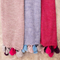 Baby alpaca knitted scarf with pompoms