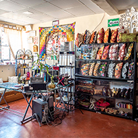 Exhibition of embroidered cushions and service desk.
