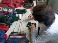 Cleaning and sewing labels on each garment