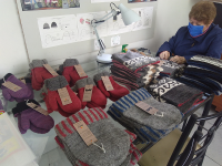 Placing hang tags on each garment