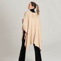 Beige cape with fringes on the neck