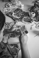 One of our partners sewing a crochet detail.