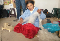 Our artisan spinning the fiber with a craft machine