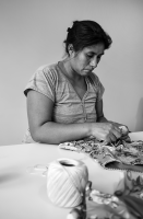 Marlene Lopez, a partner of Capittana, adding the last details to one of our pieces.