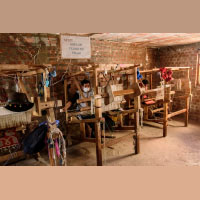 Weaving on loom. 