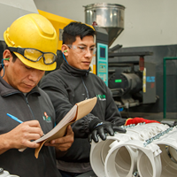 Factory with injection and assembly machines.